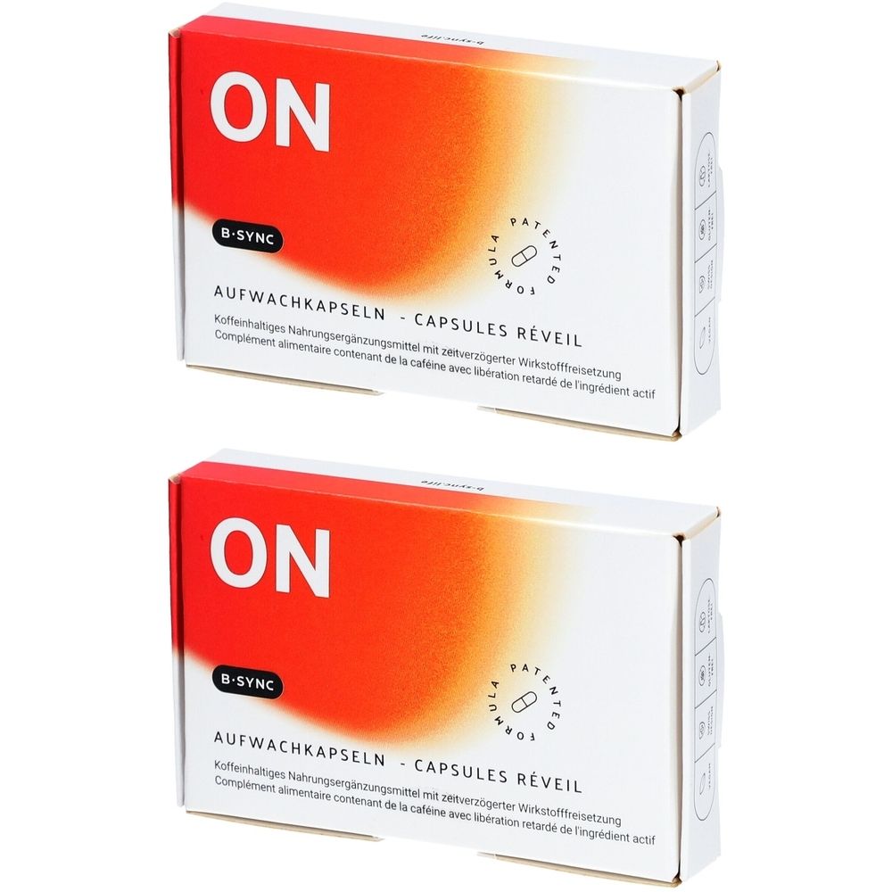 Zwei weiße Schachteln mit rotem und orangefarbenem Design. Aufschrift "ON", "B-SYNC" und "AUFWACHKAPSELN - CAPSULES RÉVEIL".
