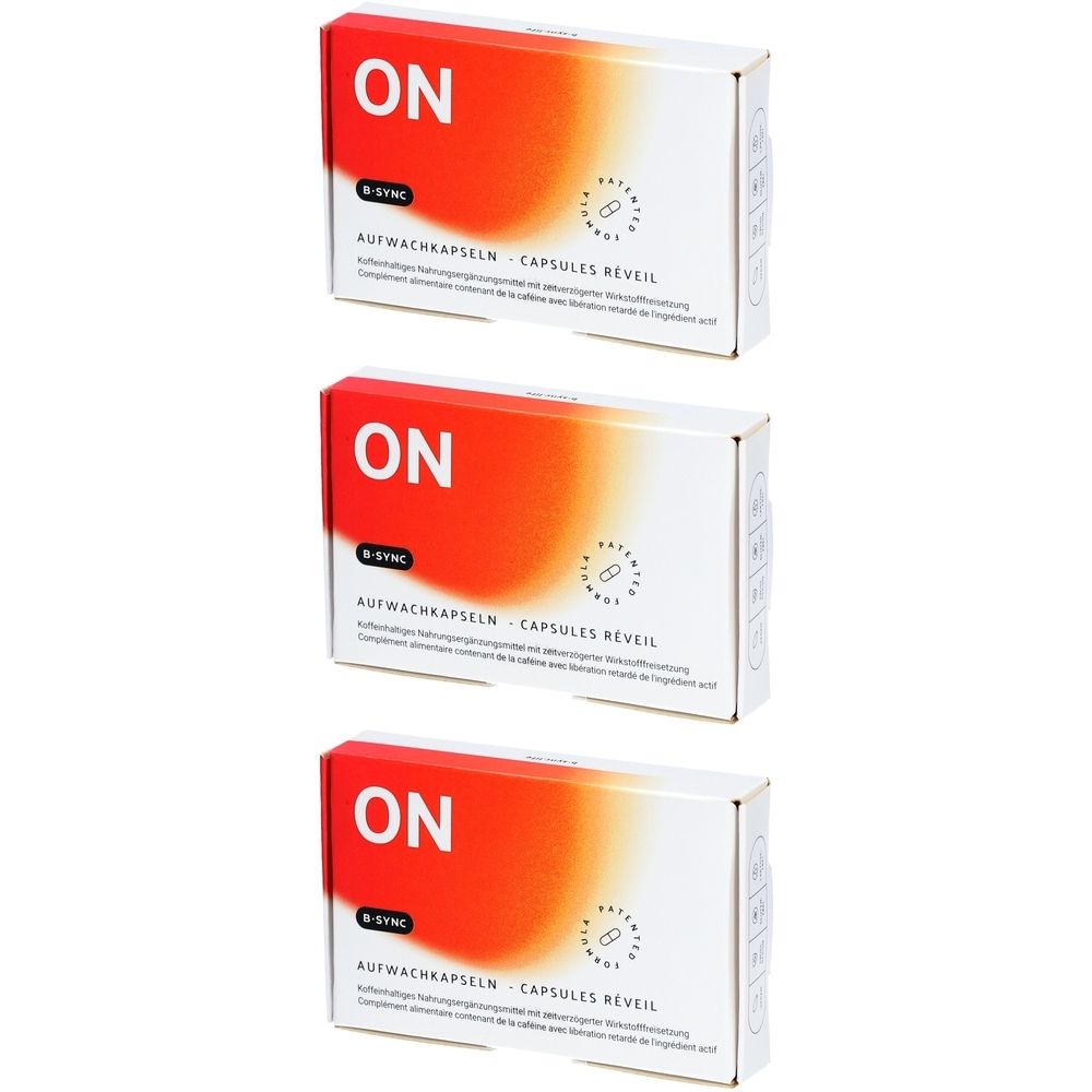 Drei weiße Schachteln mit rotem und orangefarbenem Design. Aufschrift "ON" und "B-SYNC". Text: Aufwachkapseln - Capsules Réveil.