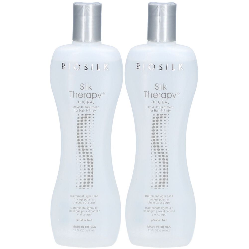 Zwei Flaschen BioSilk Silk Therapy Original. Weiße Flaschen mit silbernen Deckeln. Text: Leave-in Treatment für Haar & Körper.