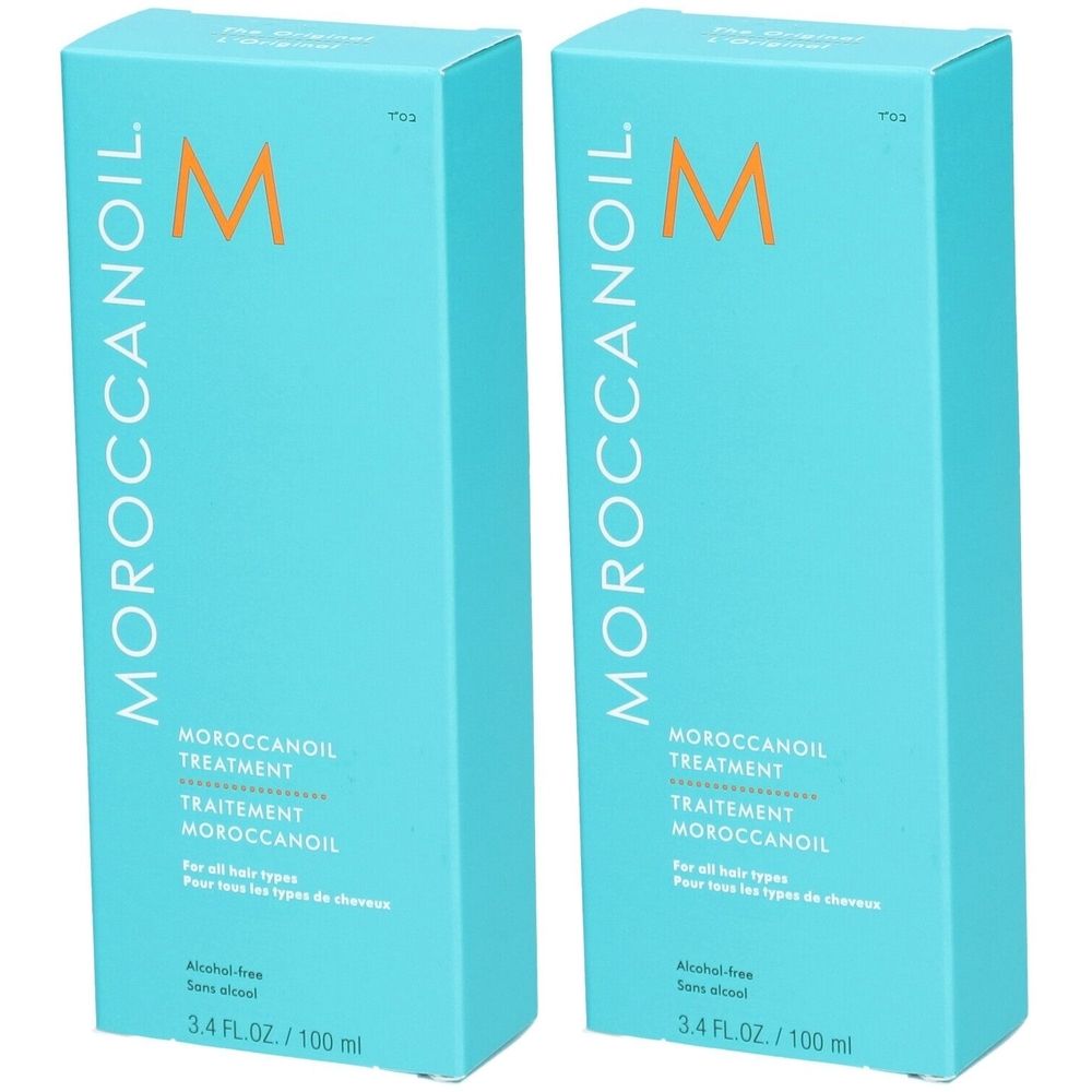 Zwei türkisfarbene Schachteln mit der Aufschrift MOROCCANOIL und dem Buchstaben M. Text: TREATMENT, TRAITEMENT, MOROCCANOIL.