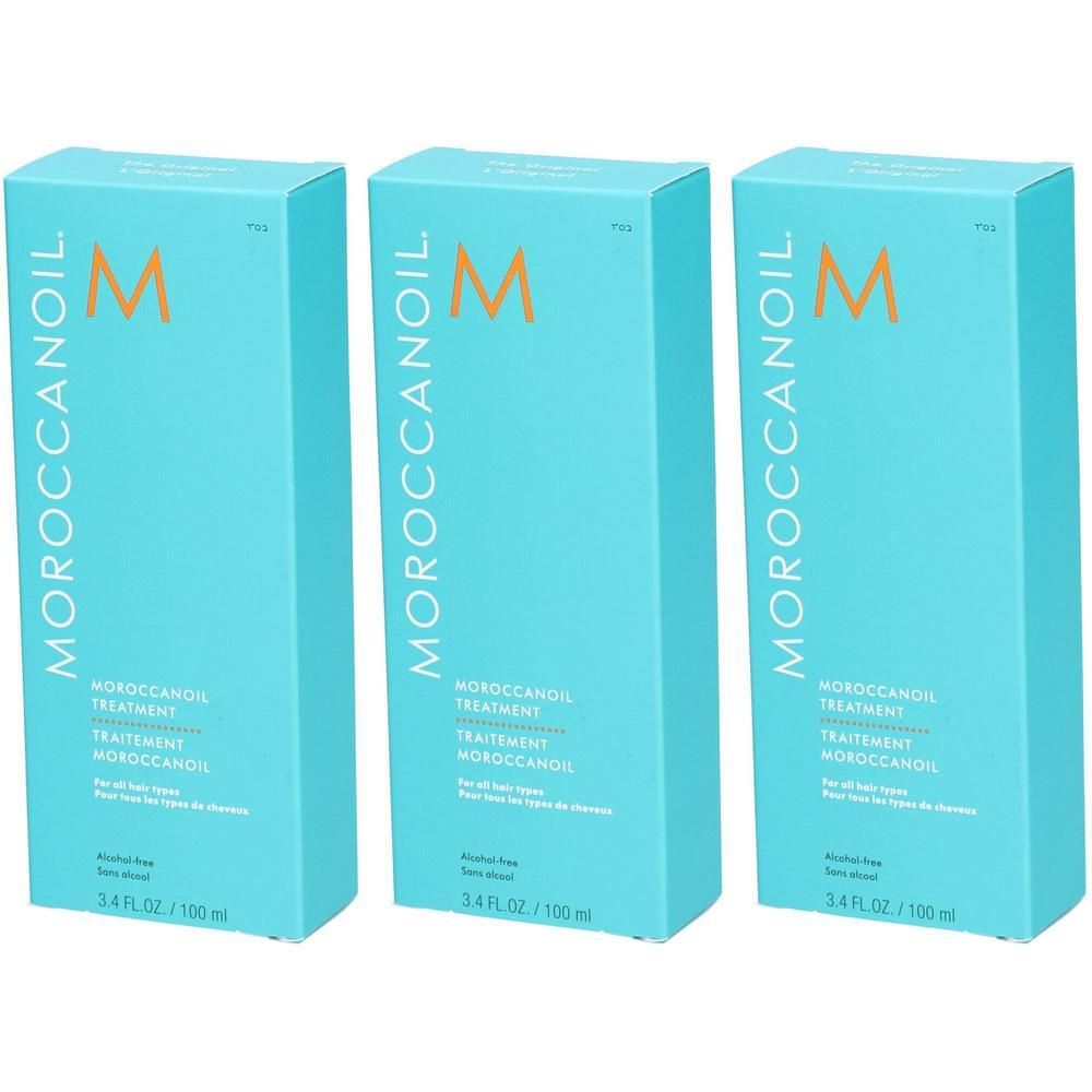 Trois boîtes de Moroccanoil Treatment Original, turquoise avec logo 'M' orange.