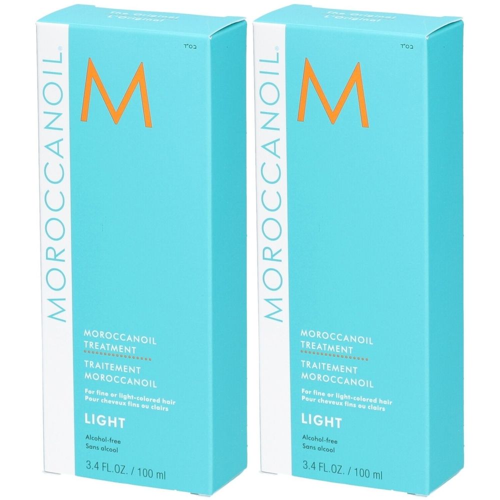 Zwei türkisfarbene Kartons mit der Aufschrift Moroccanoil. Aufschrift: Treatment Light, 3.4 FL.OZ./100 ml.