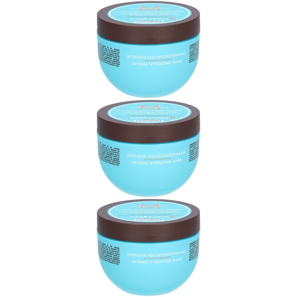 Trois pots bleus avec des couvercles marron. On peut lire "Intensive Feuchtigkeitsmaske" et "Intense Hydrating Mask".
