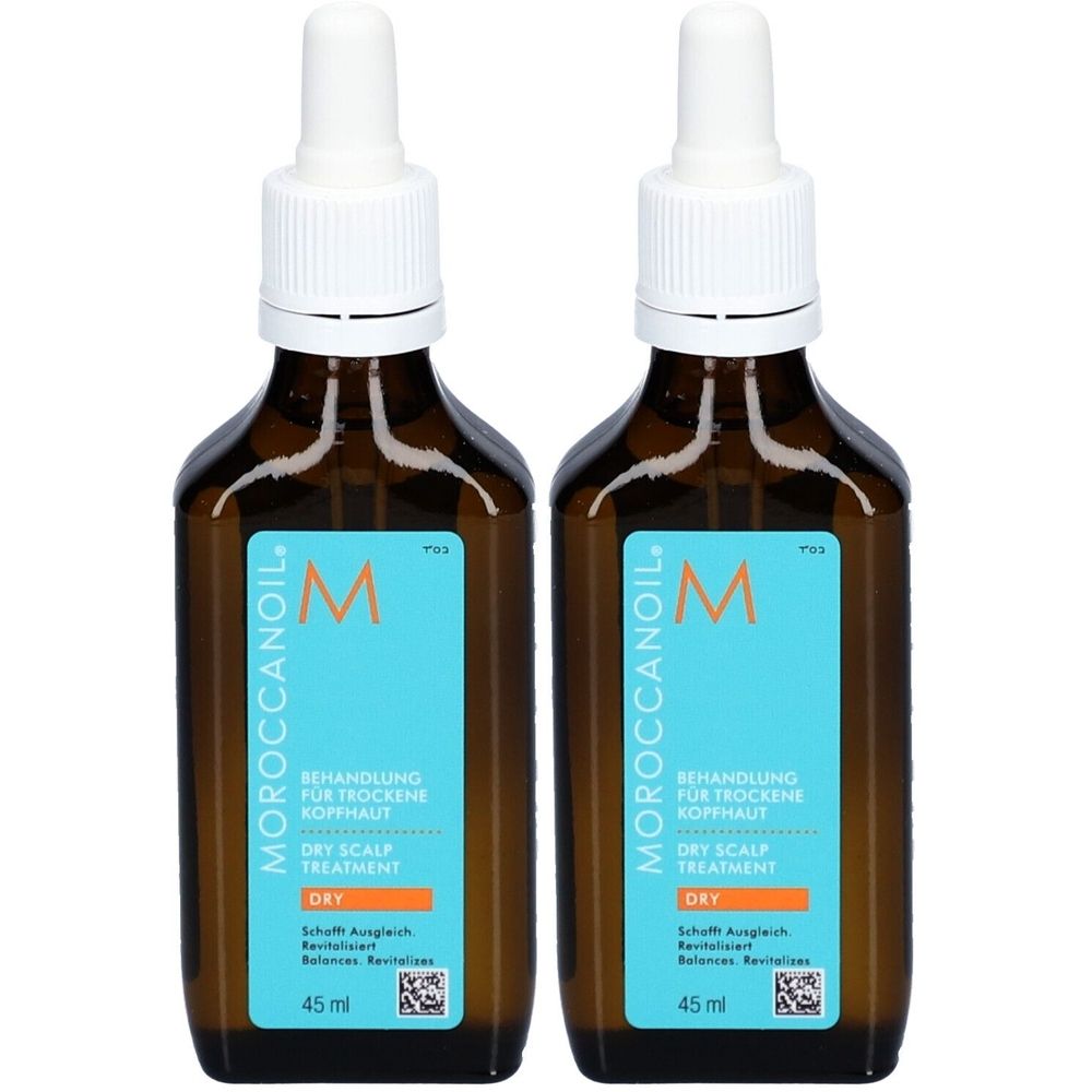 Deux flacons bruns avec bouchon blanc et pipette. L'étiquette bleue porte "MOROCCANOIL" et "BEHANDLUNG FÜR TROCKENE KOPFHAUT".