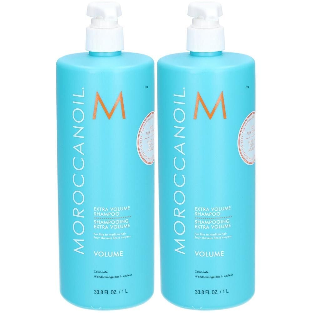 Deux flacons pompe turquoise de Moroccanoil Extra Volume Shampoo.