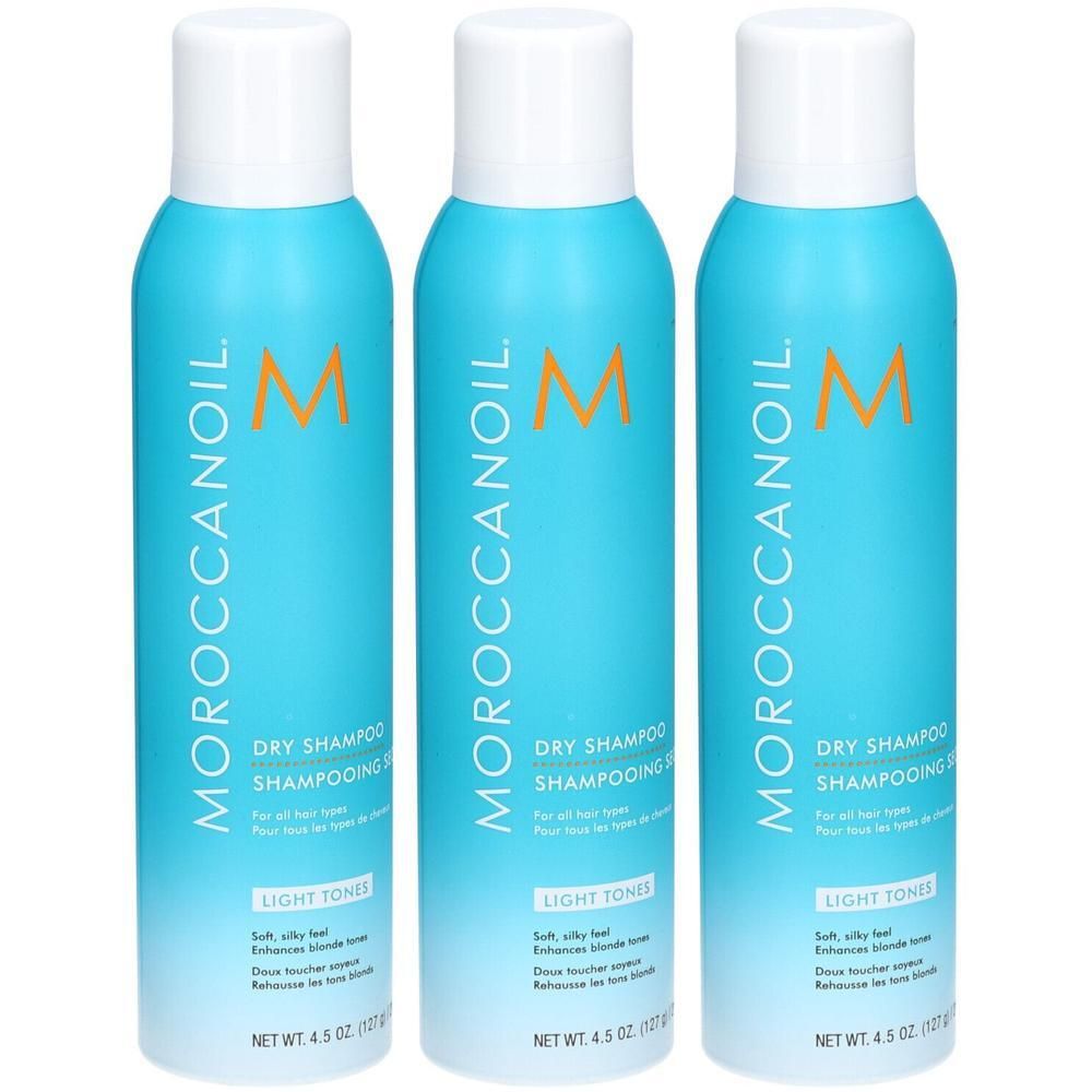 Trois canettes de shampooing sec Moroccanoil pour tons clairs. Chaque canette contient 127g.