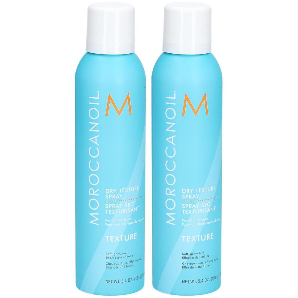 Deux aérosols bleu clair avec bouchon blanc, Moroccanoil Dry Texture Spray.
