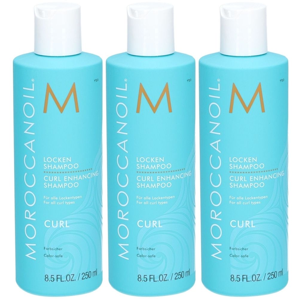 Trois flacons turquoise avec bouchons blancs. Chaque flacon porte l'inscription "Moroccanoil Locken Shampoo".
