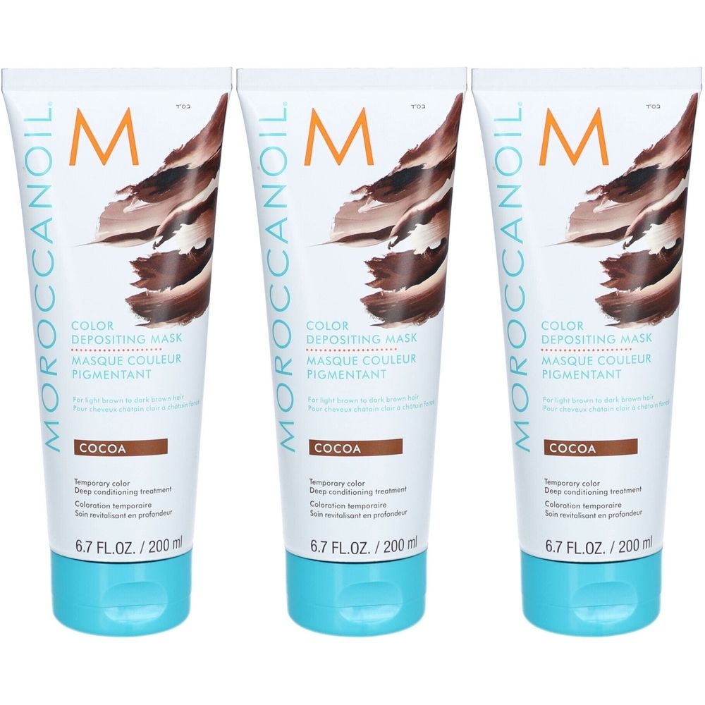 Trois tubes de Moroccanoil Pigmentfärbemaske Cocoa. Tubes blancs avec design marron et bouchon turquoise. Texte : Color Depositing Mask, 6.7 FL.OZ./200 ml.