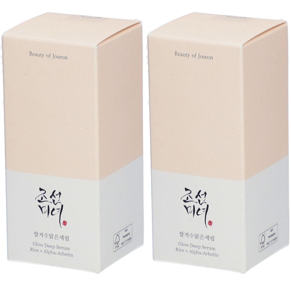 Zwei rechteckige Kartons. Aufschrift: Beauty of Joseon, koreanische Schriftzeichen, Glow Deep Serum, Reis + Alpha-Arbutin. Beige und weiß.