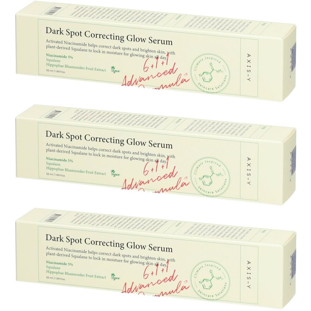 Drei Kartons mit "Dark Spot Correcting Glow Serum". Text: AXIS-Y, 6+1+1 Advanced Formula.