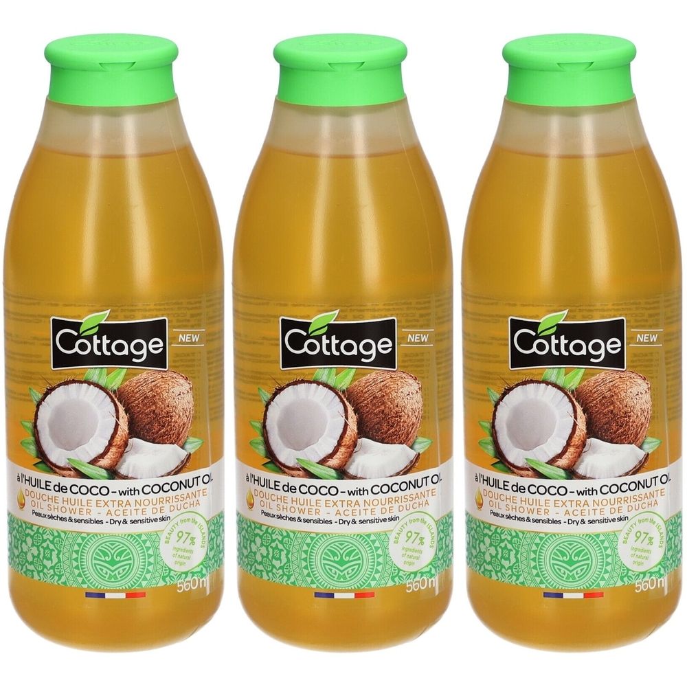 Drei Flaschen mit grünem Deckel. Aufschrift: Cottage, Kokosnuss-Öl. Für trockene und empfindliche Haut. 97%.