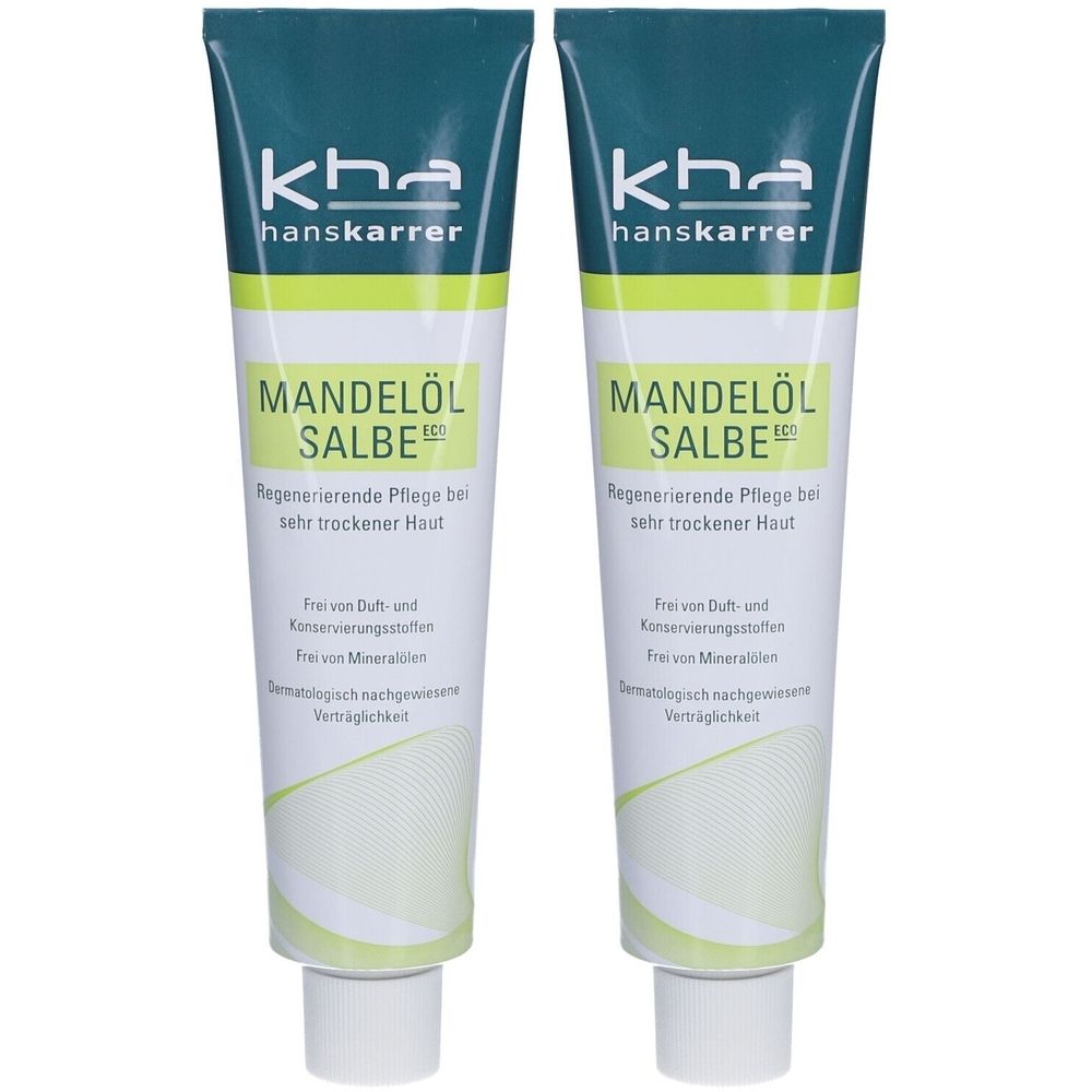 Deux tubes de crème au beurre de karité. Emballage vert et blanc avec nom du produit et logo du fabricant. Texte: Soin régénérant pour peaux très sèches.