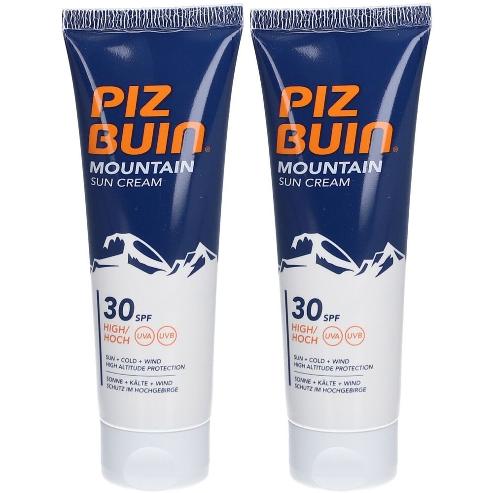 Deux tubes de crème solaire Piz Buin Mountain SPF30. Tubes bleus avec texte blanc et motif montagne. Protection UV.