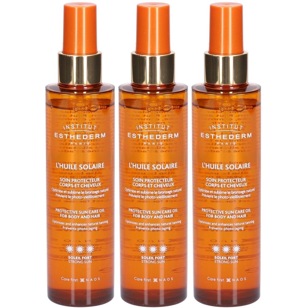 Drei Flaschen Sonnenöl. Orangefarbene Sprühköpfe, goldfarbene Ringe. Beschriftung: INSTITUT ESTHEDERM, L'HUILE SOLAIRE, SOIN PROTECTEUR CORPS ET CHEVEUX.