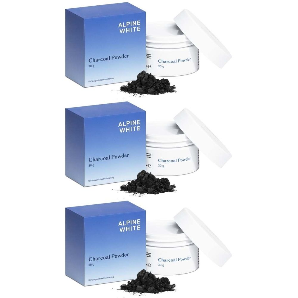 Drei Packungen und Tiegel mit Kohlepulver. Blaue Schachteln mit "ALPINE WHITE" und "Charcoal Powder" Aufschrift. Schwarzes Pulver daneben.