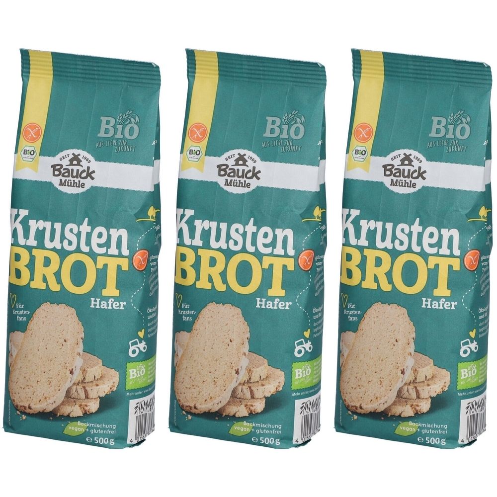 Drei Beutel Krustenbrot Hafer Bio-Kochmischung. Grüne Verpackung mit gelben Akzenten. Aufdrucke: "Bauck Mühle", "Krusten Brot", "Hafer", Bio-Siegel.
