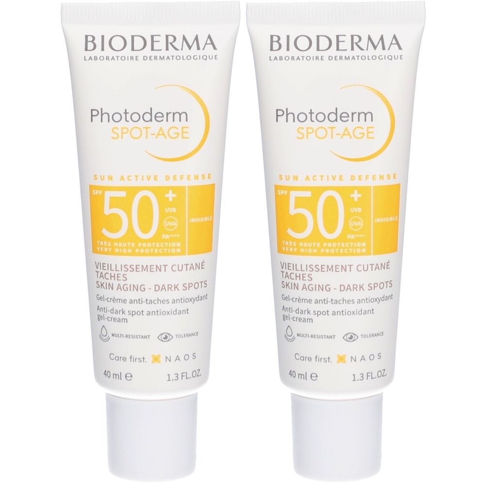 Zwei Tuben BIODERMA Photoderm Spot-Age SPF50+. Weiße Tuben mit gelben Akzenten. Text: SPF 50, Anti-Aging, Anti-Flecken.