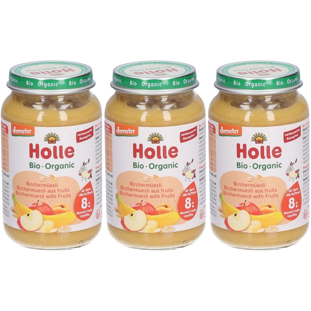 Trois pots de Holle Bio-Organic Birchermüsli aux fruits. Pots avec couvercles verts, étiquettes avec illustration et texte.