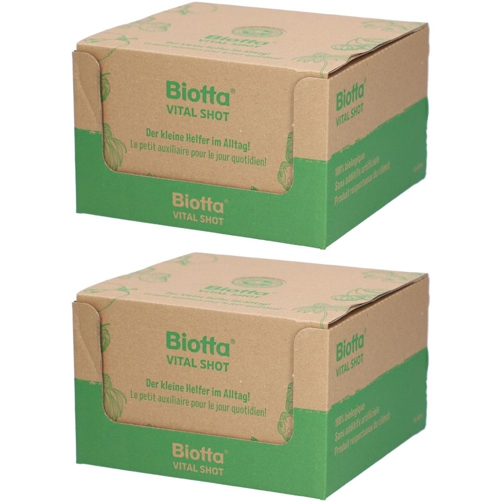 Zwei Kartons mit der Aufschrift "Biotta Vital Shot". Die Verpackungen sind braun mit grünen Akzenten und Text.