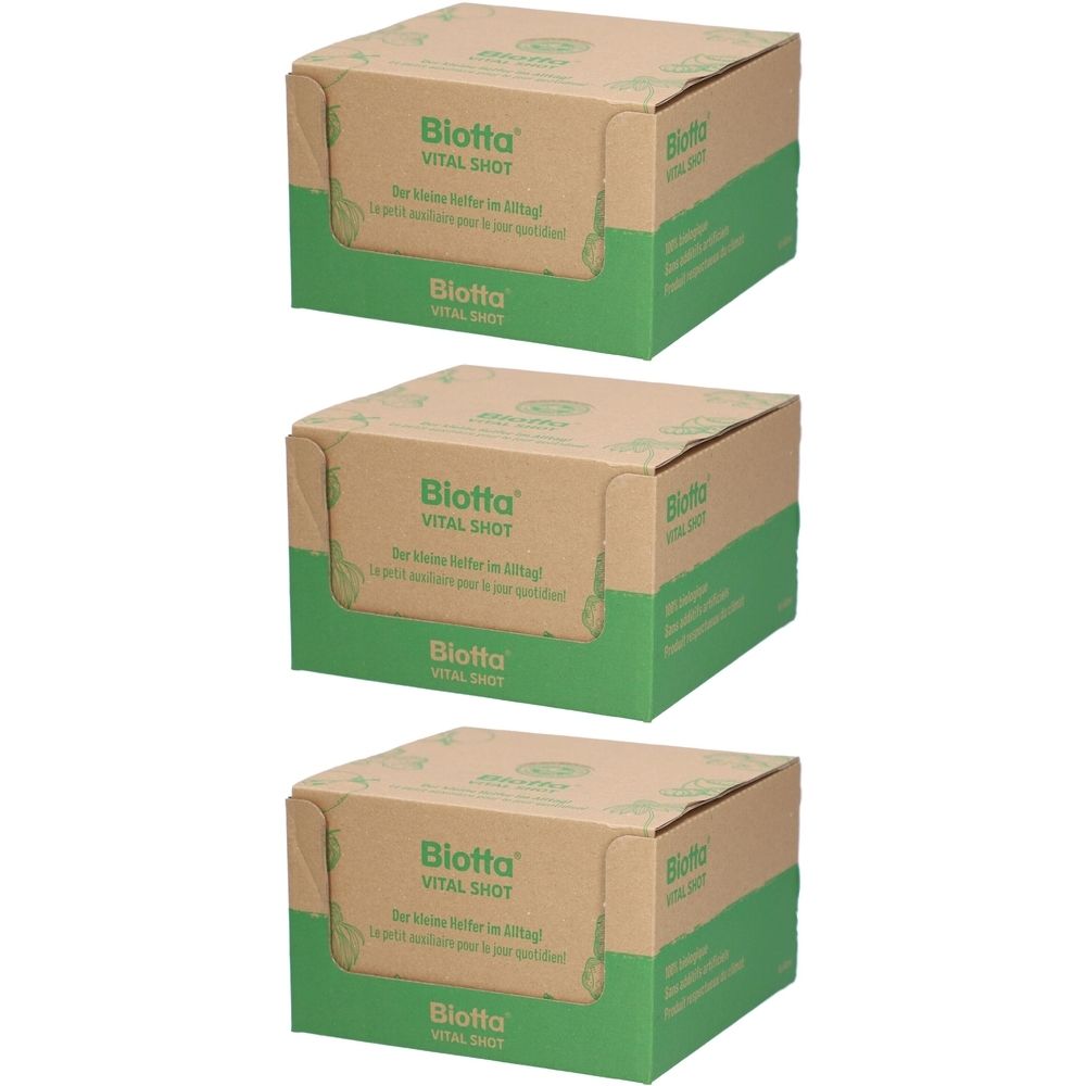 Drei Kartons mit "Biotta Vital Shot". Braune Kartons mit grünen Akzenten und Produktinformationen.