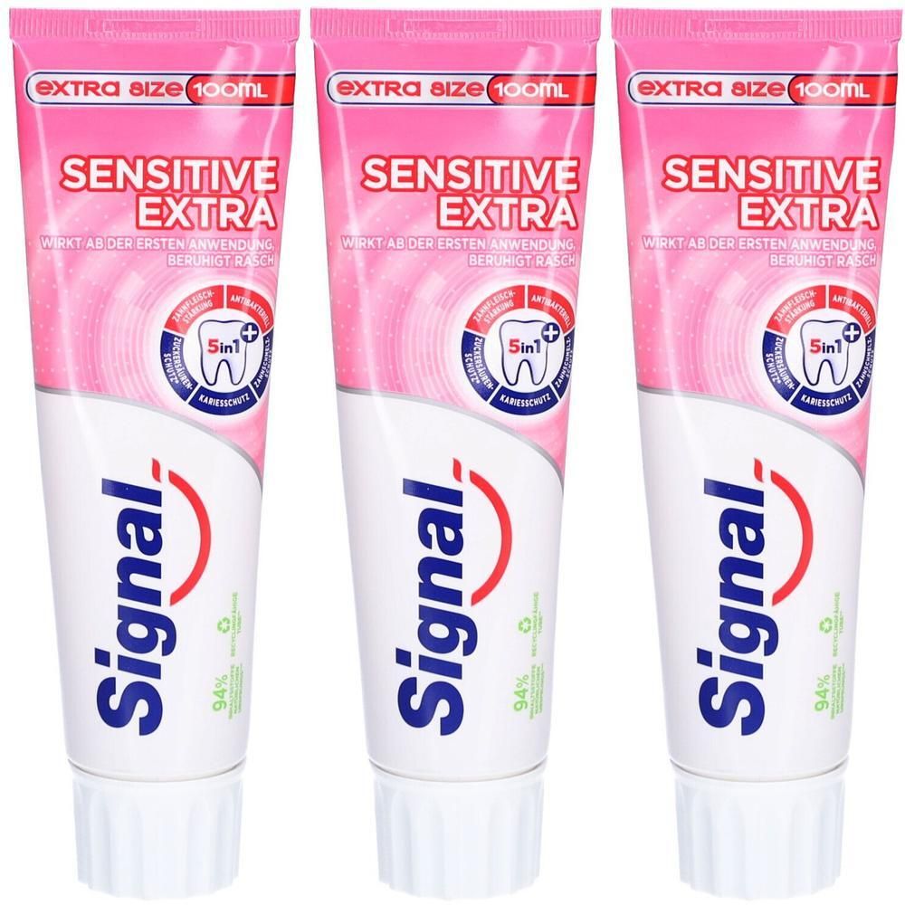 Trois tubes de dentifrice Signal Sensitive Extra. Design rose et blanc, logo et texte. Extra Size 100ml.
