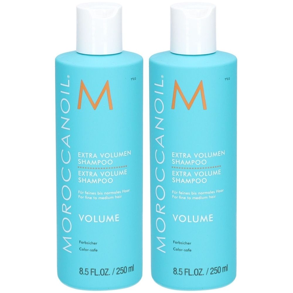 Deux flacons de shampooing turquoise avec bouchons blancs. Inscription : Moroccanoil, Extra Volumen Shampoo, 8.5 FL.OZ./250 ml.