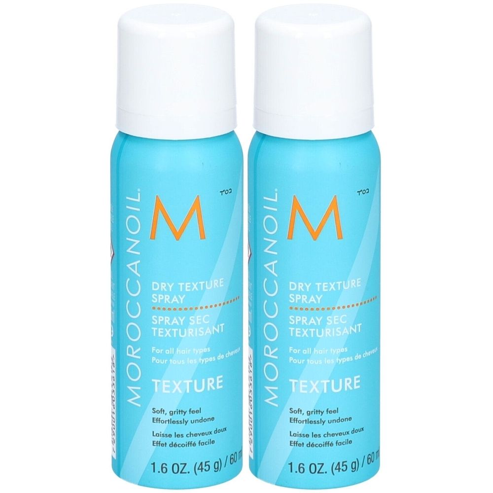 Zwei blaue Sprühflaschen mit weißem Deckel. Aufschrift: Moroccanoil, Dry Texture Spray. 1.6 oz.