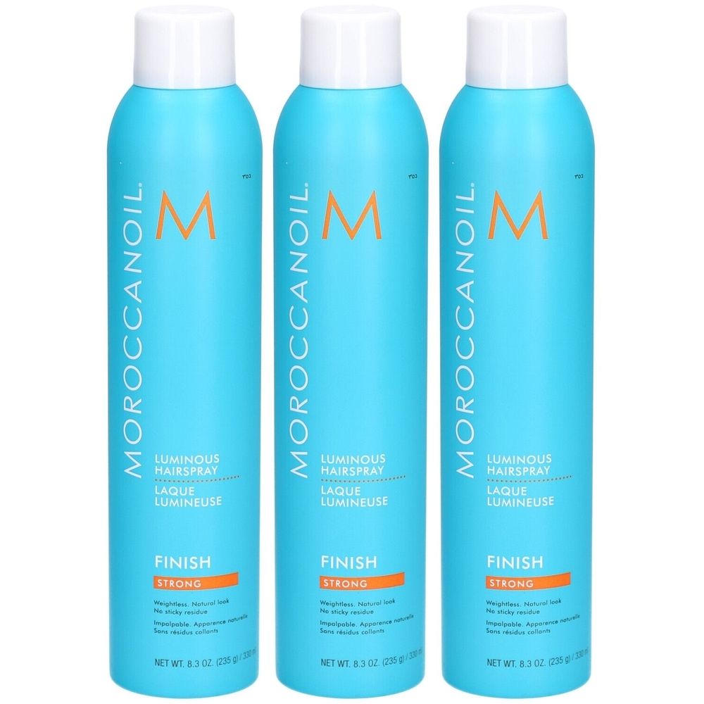 Drei blaue Sprühflaschen mit weißem Deckel. Aufschrift: MOROCCANOIL, Luminous Hairspray, Finish Strong. Orangefarbene Akzente.