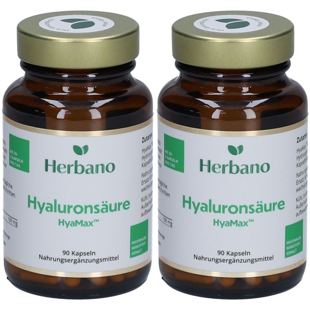 Zwei braune Glasflaschen mit goldfarbenen Deckeln. Auf den Etiketten steht "Herbano Hyaluronsäure HyaMax" und "90 Kapseln".