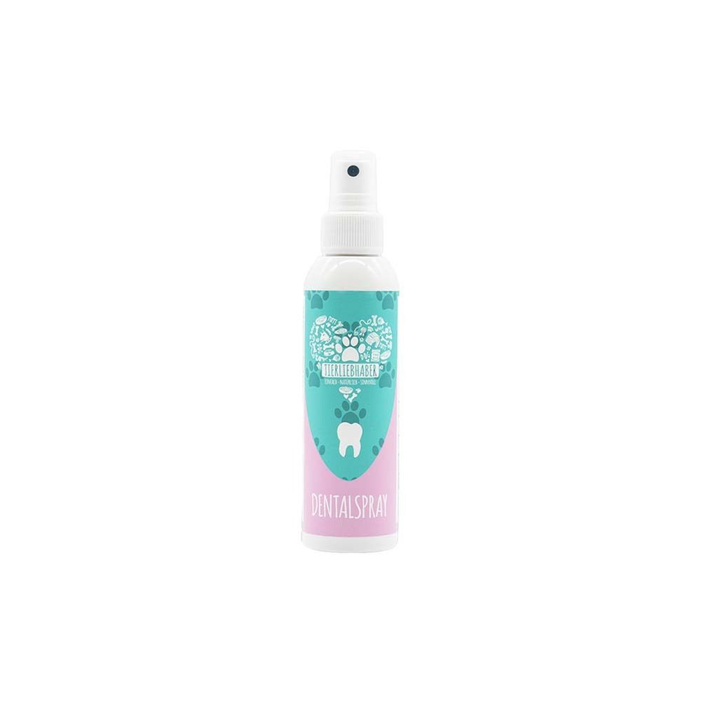 Flacon de spray dentaire. Tête de pulvérisation blanche, étiquettes turquoise et roses. Inscription : DENTALSpray.