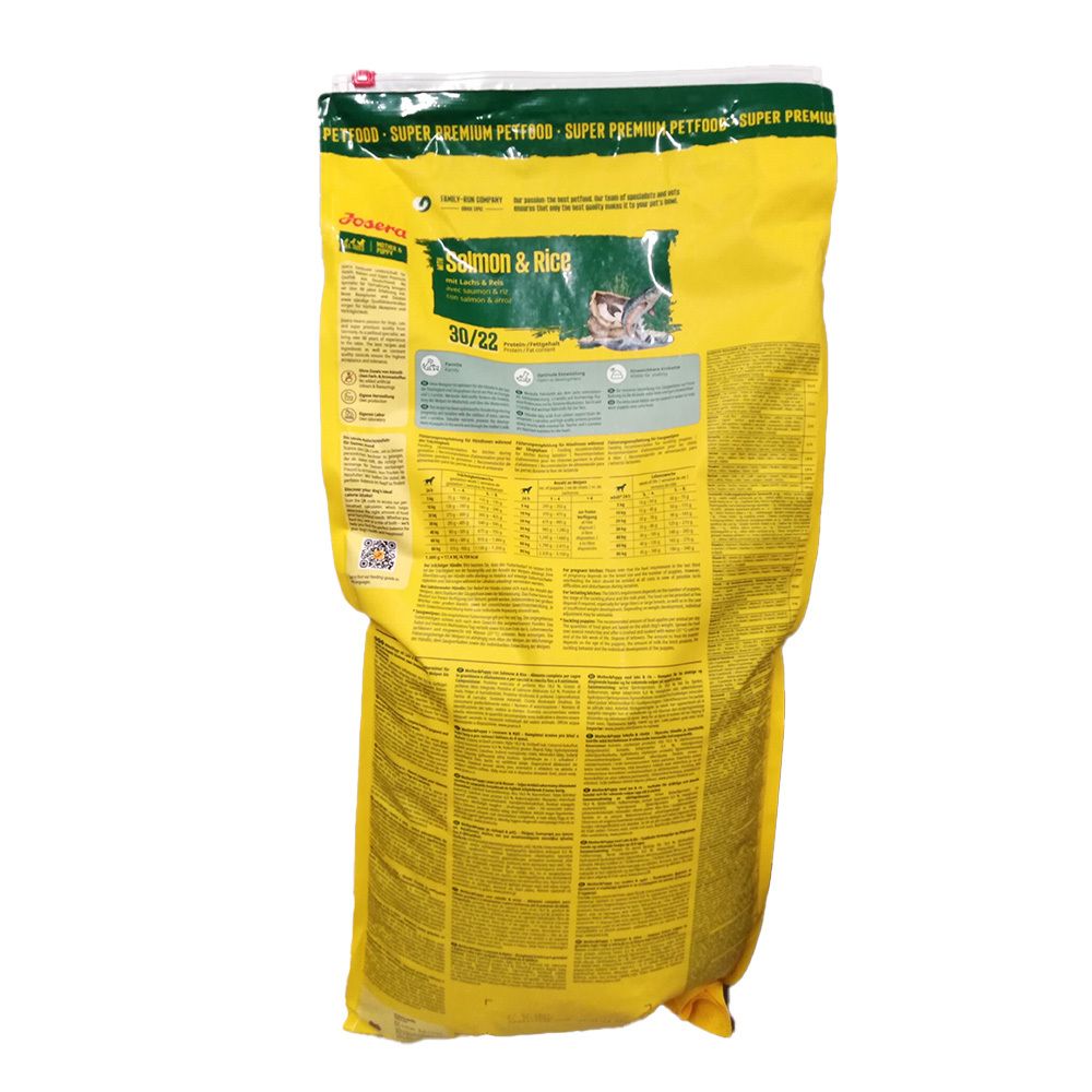 Dos du sac jaune. Inscription : Josera Salmon & Rice. Texte et tableaux. Détails vert et blanc.