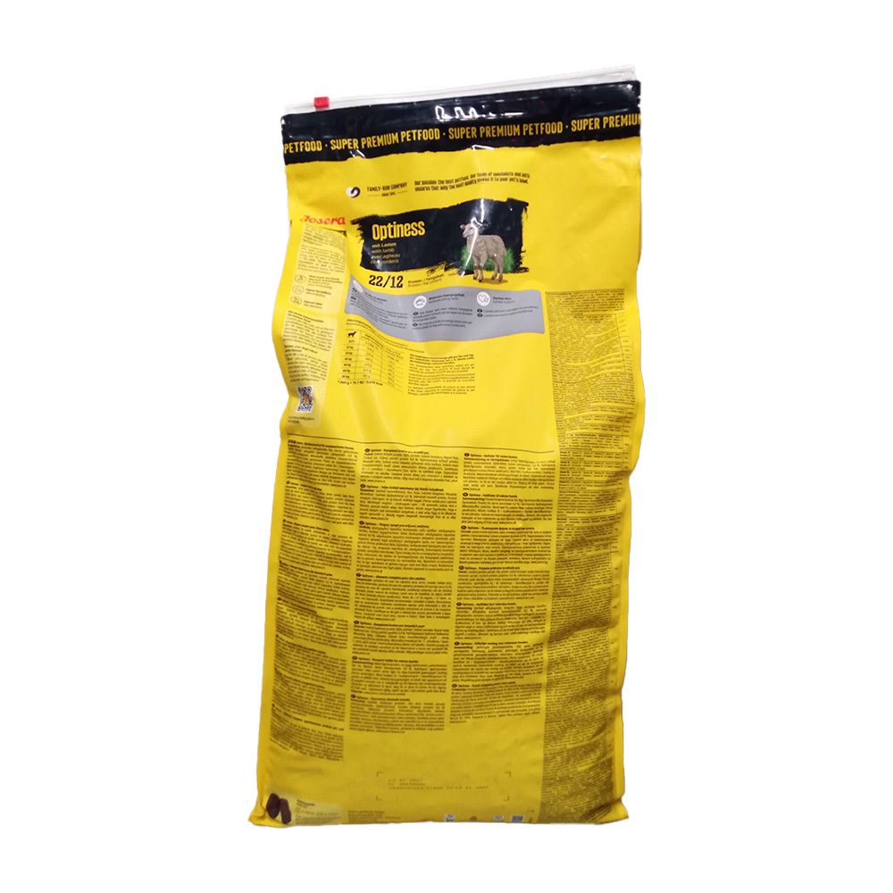 Dos d'un sac jaune de nourriture pour chiens. Texte et informations sur le produit.