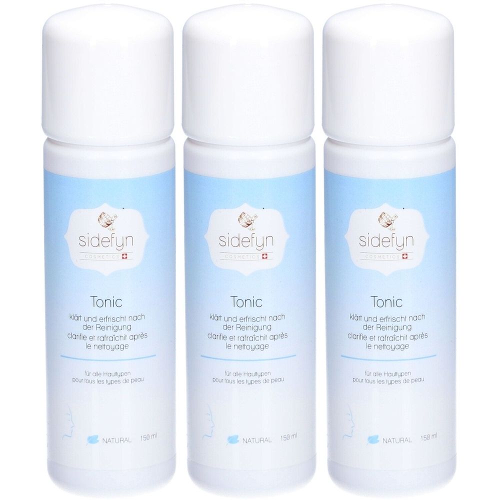 Trois flacons de Sidefyn Tonic. Bouchons blancs, étiquettes bleu clair avec logo et texte. Croix suisse.