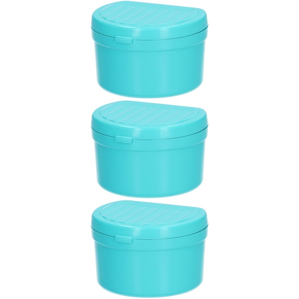Trois boîtes à dents turquoises avec couvercles rainurés. Forme ronde avec fermeture à rabat.