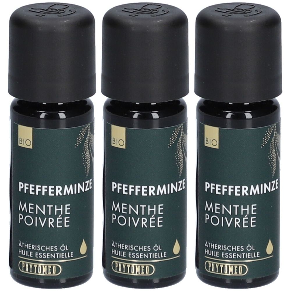 Trois flacons avec bouchons noirs et étiquettes vertes. Inscription : Pfefferminze, Menthe Poivrée, Huile essentielle, Phytomed. Label Bio.