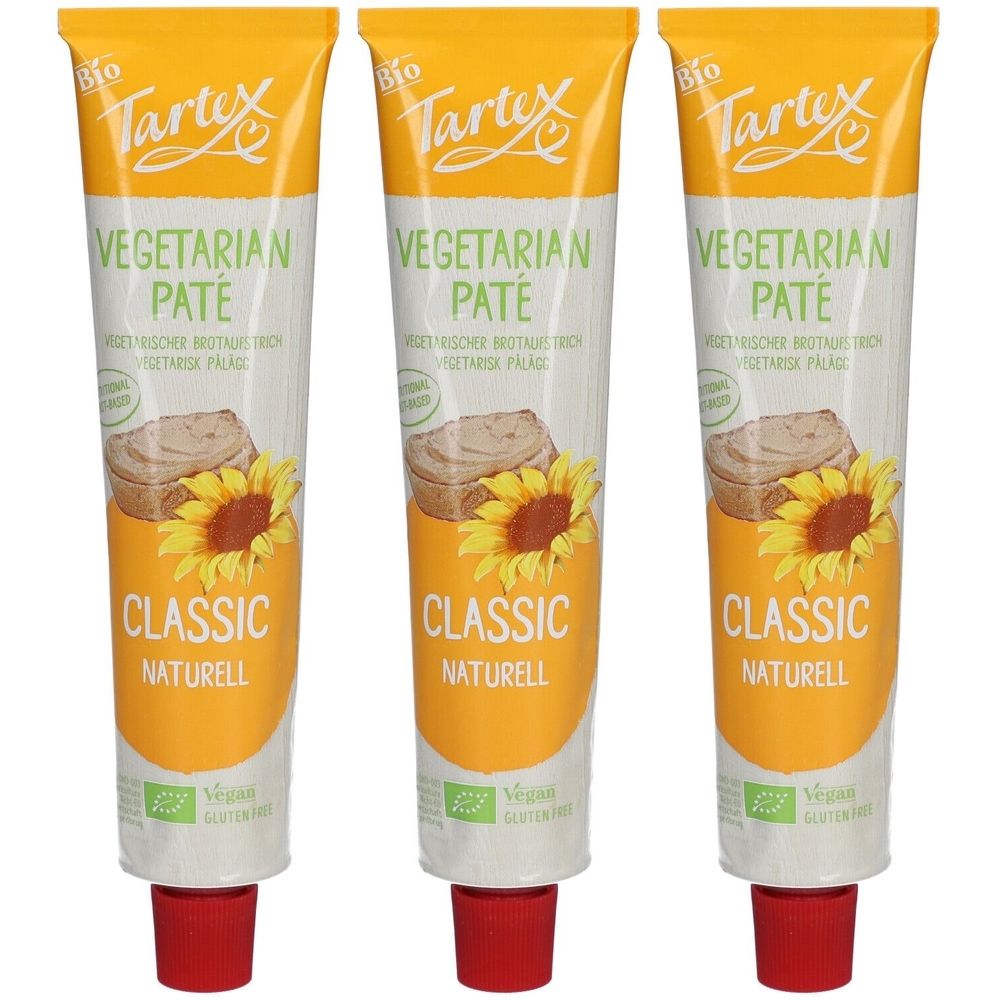 Drei Tuben Tartex Vegetarische Bio-Pastete Classic Natur. Weiße Tuben mit gelbem Deckel, Text und Sonnenblumen-Illustration.