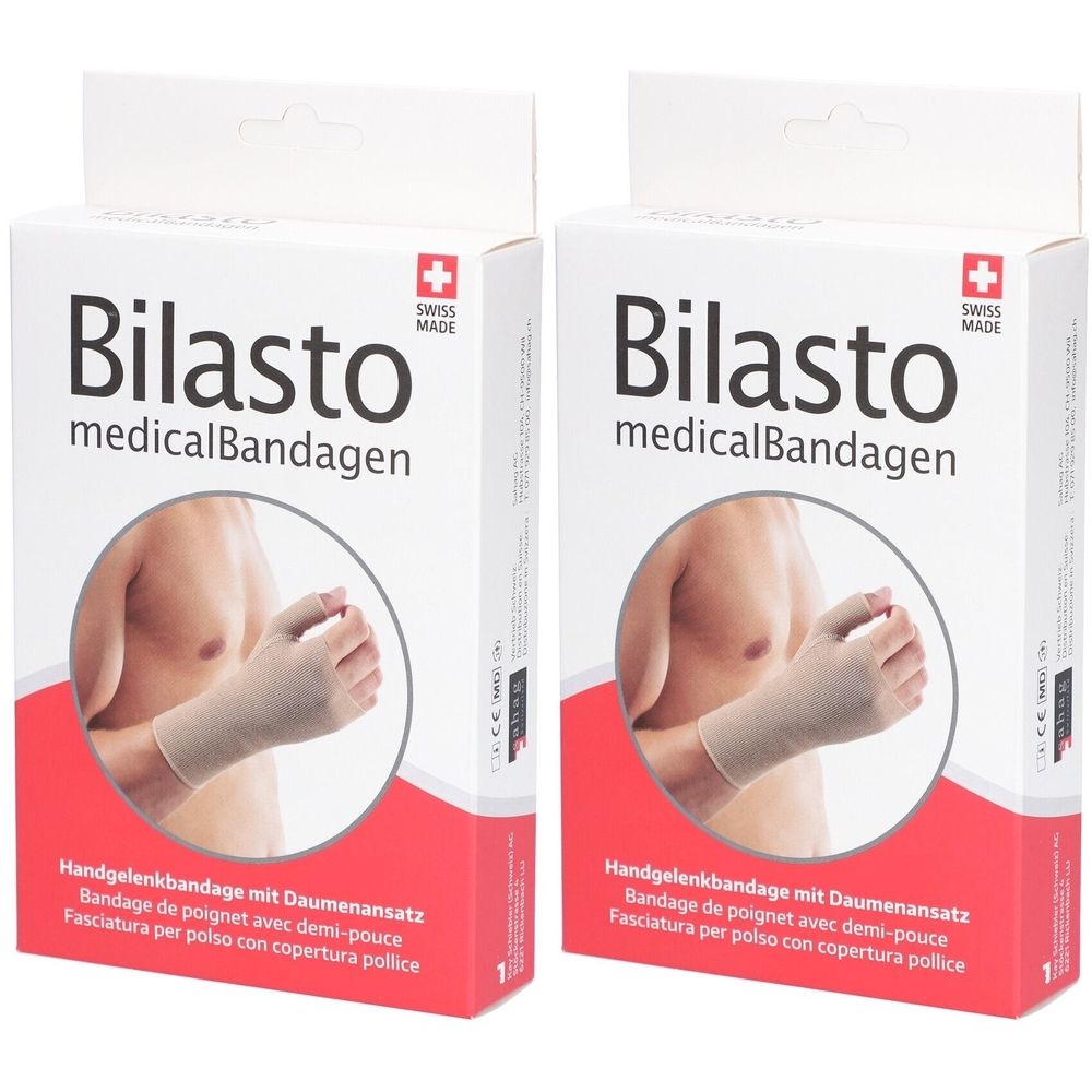 Zwei Packungen Bilasto Handgelenkbandage. Weißer Karton mit Produktabbildung und Text. Schweizer Kreuz. Handgelenkbandage mit Daumenansatz.