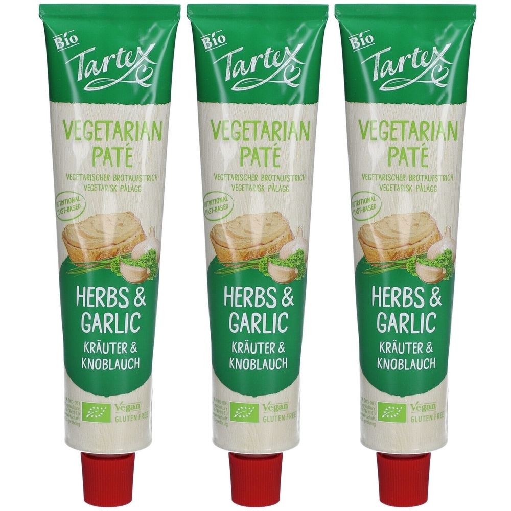 Drei Tuben Tartex BIO-Aufstrich Kräuter und Knoblauch. Aufschrift: Vegetarian Paté, Herbs & Garlic. Vegan, glutenfrei.