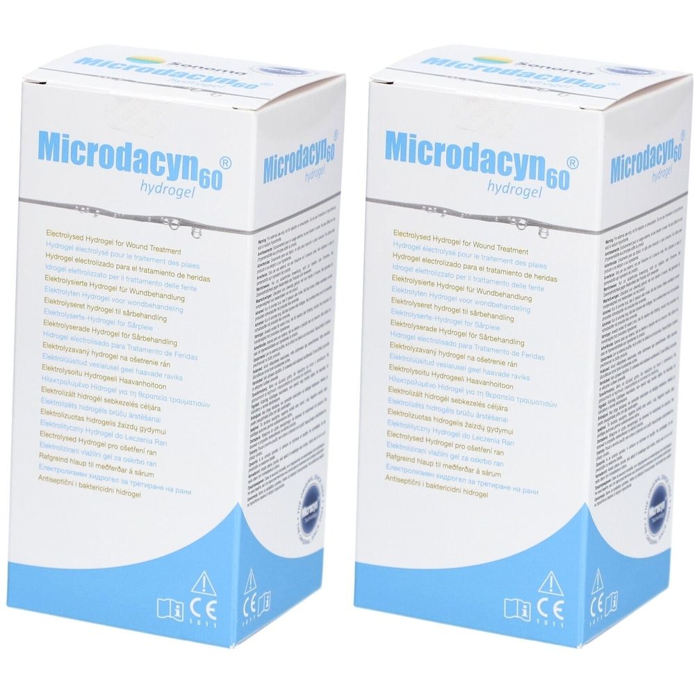 Zwei Kartons Microdacyn60® Hydrogel. Blaue und weiße Verpackung mit Produktnamen und Text. CE-Kennzeichnung.