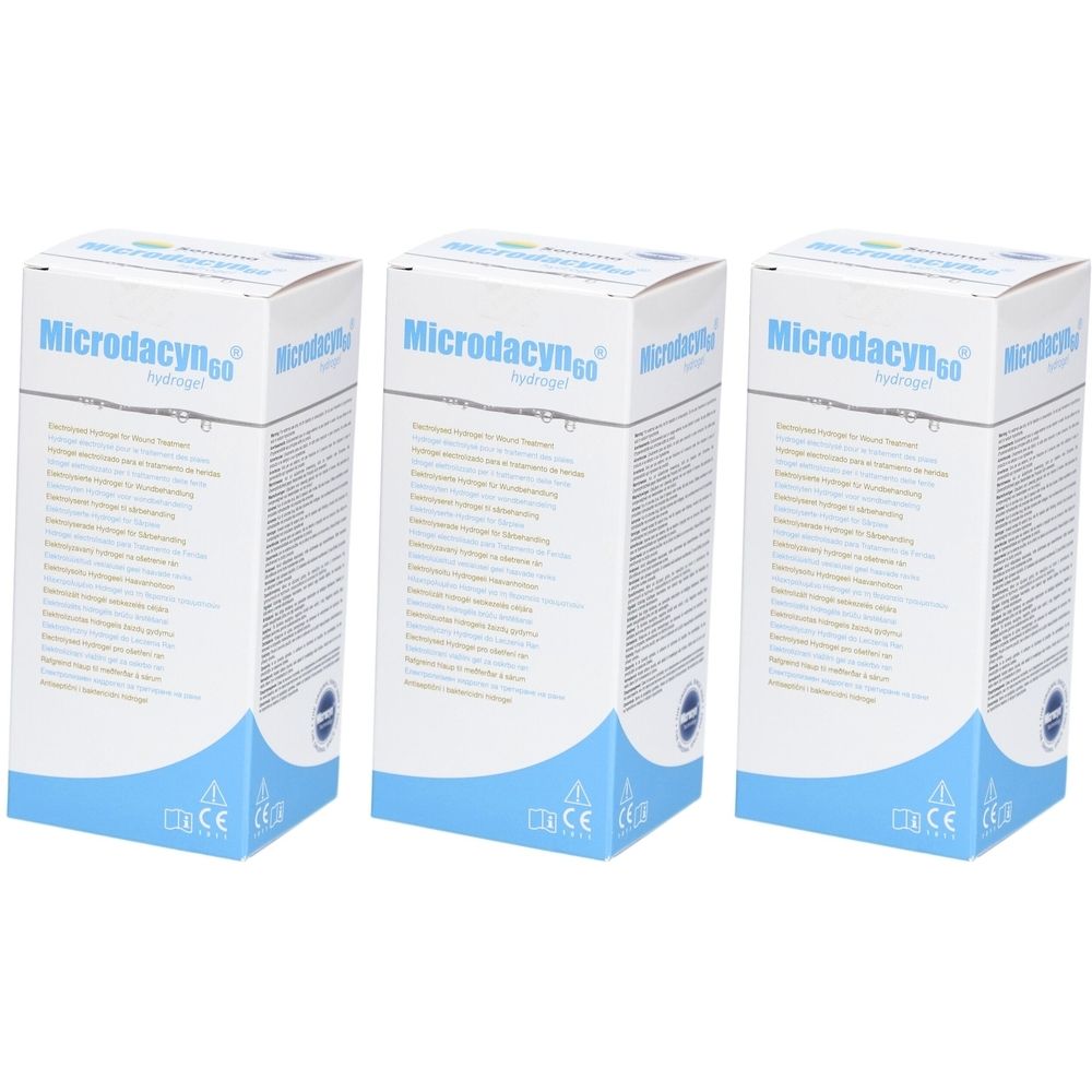 Drei rechteckige Kartons. Aufschrift Microdacyn60. Weiß, mit blauen Akzenten und Text. CE-Kennzeichnung.