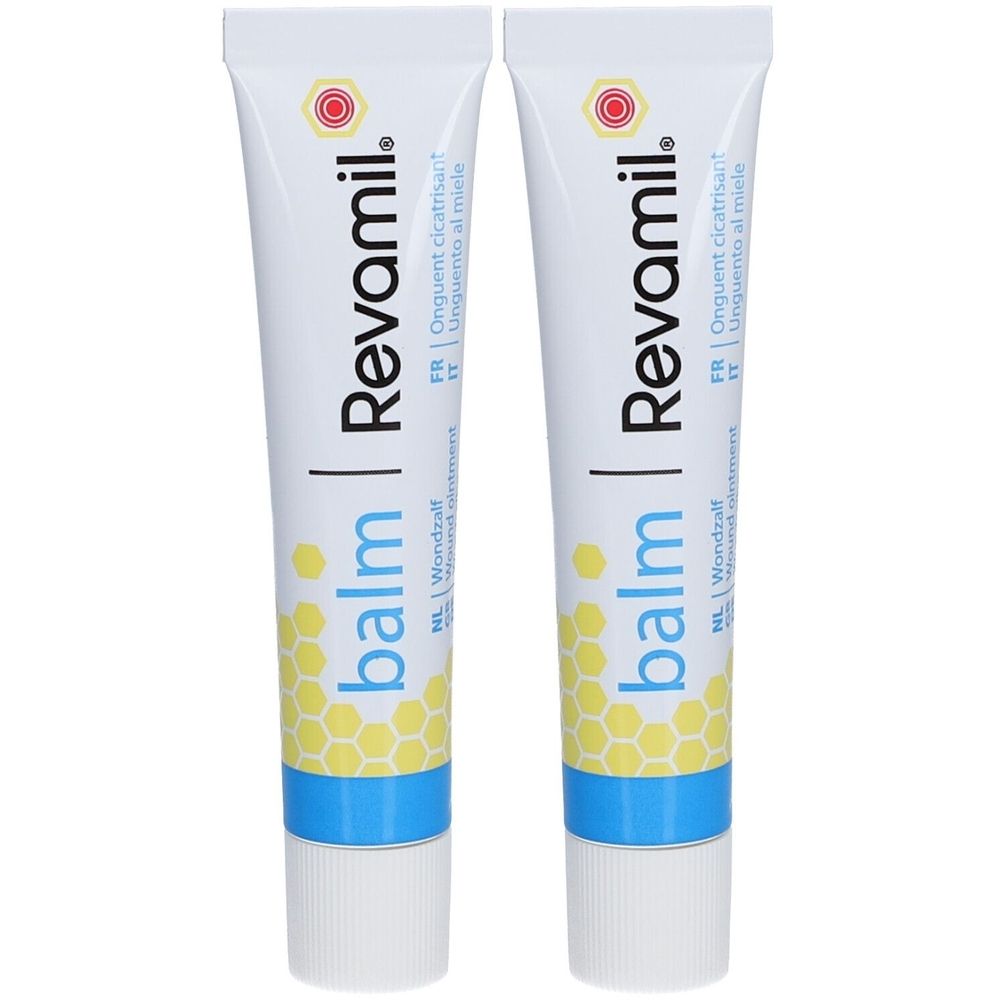 Zwei Tuben mit weißem Hintergrund. Auf jeder Tube steht "Revamil balm". Text in Französisch, Italienisch und Niederländisch.