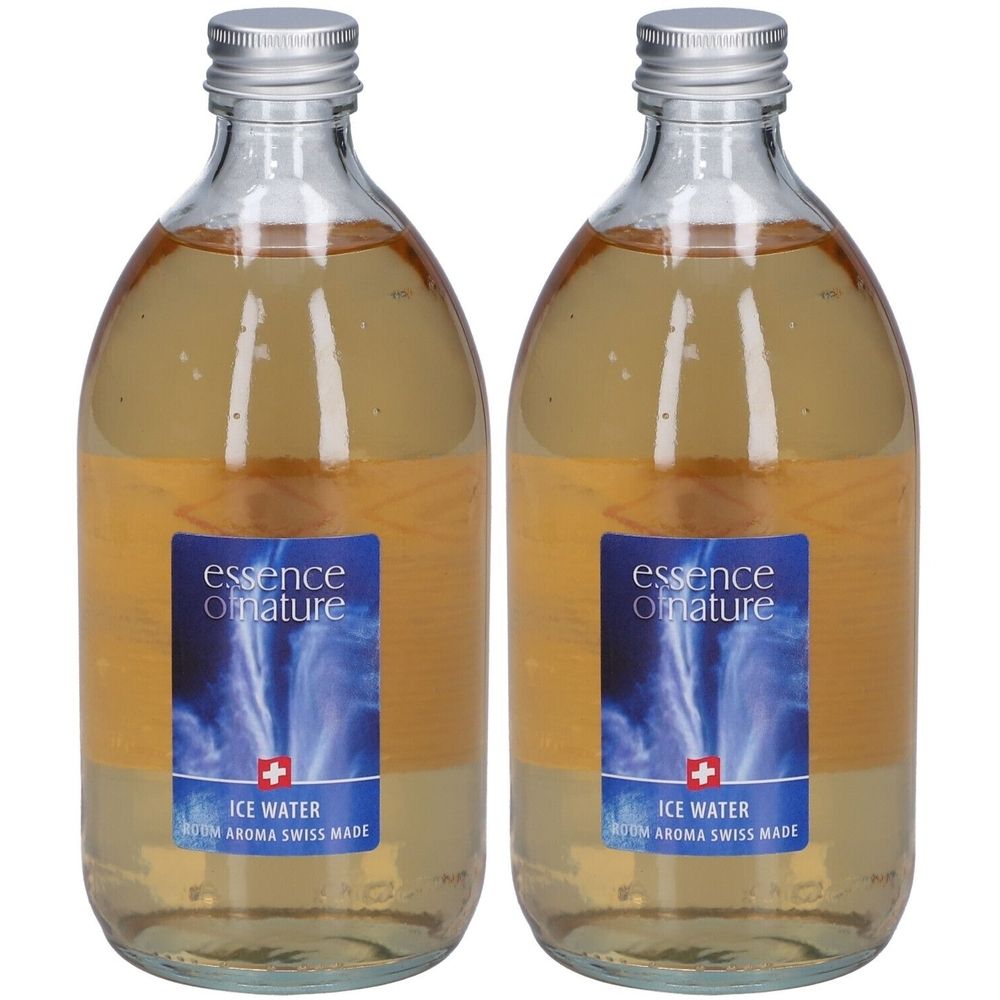 Deux flacons en verre avec bouchons argentés. Étiquettes avec "essence of nature", "Ice Water" et croix suisse.