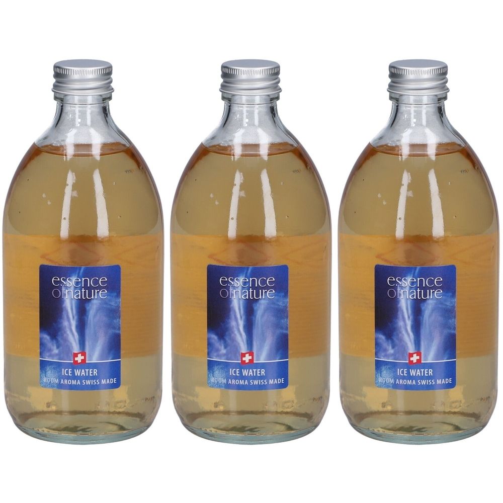 Trois flacons en verre avec liquide. Étiquette avec logo, texte et croix suisse. Bouchon métallique.