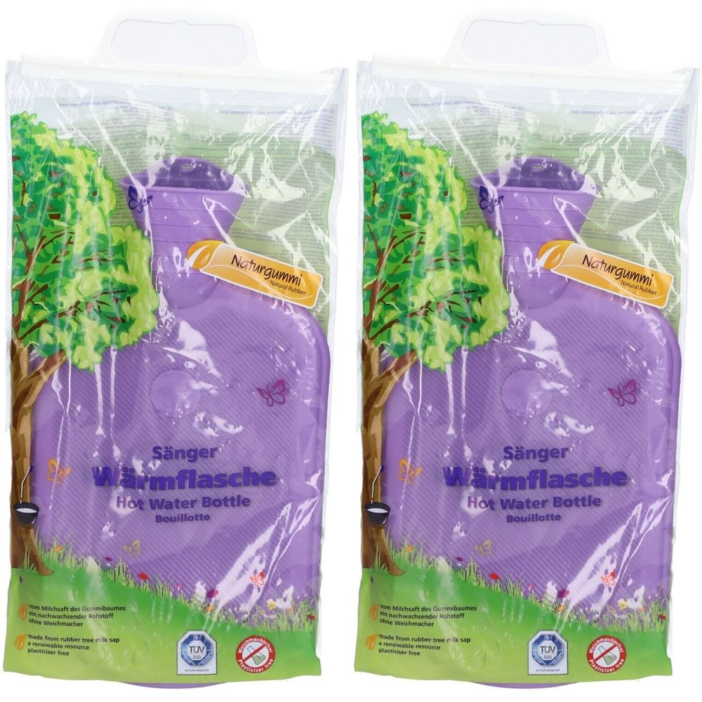 Deux bouillottes violettes dans un emballage plastique. Inscription : Sänger Wärmflasche, Hot Water Bottle, Bouillotte. Avec le sceau TÜV.