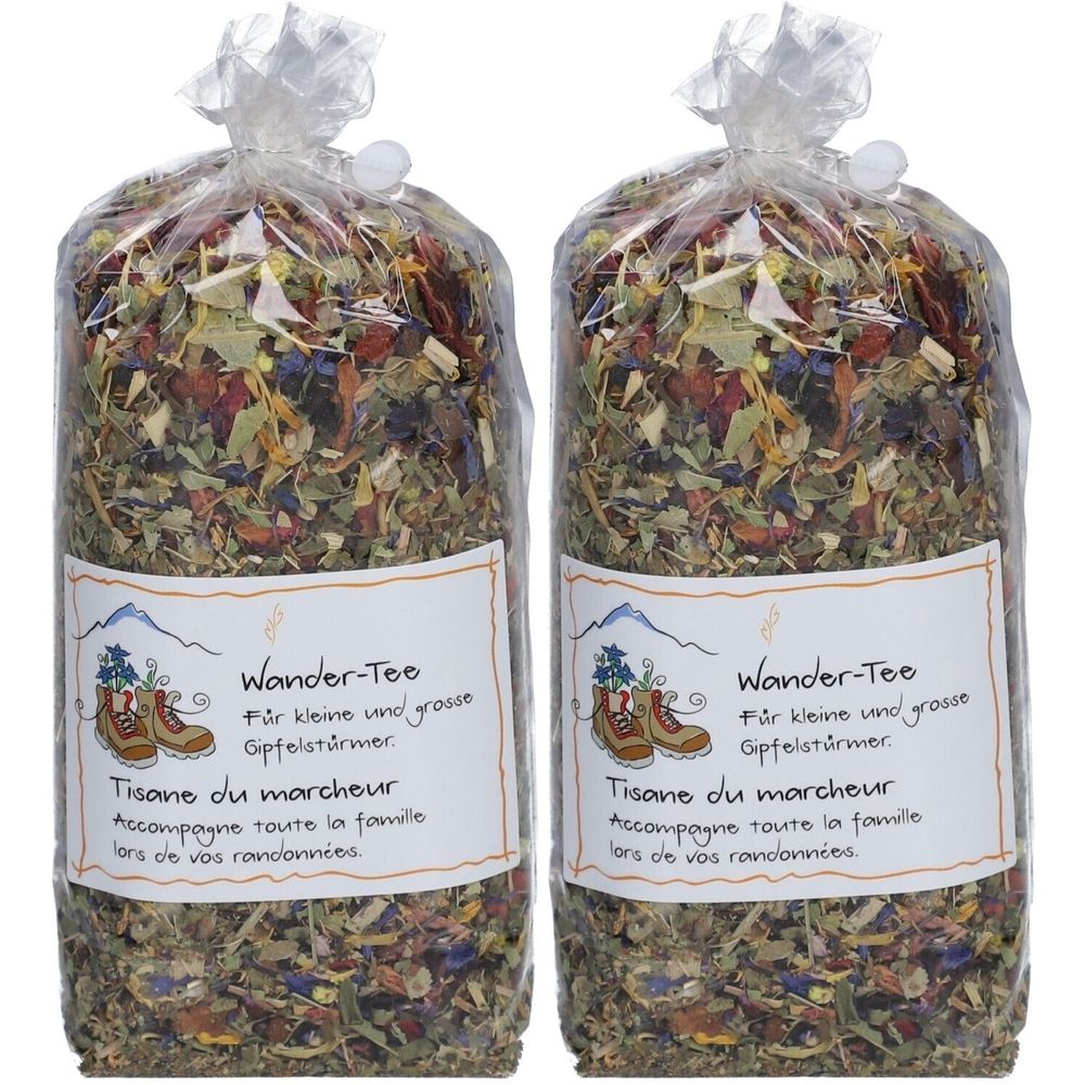 Zwei Beutel Wander-Tee mit Kräutermischung. Aufschrift: Wander-Tee, Tisane du marcheur. Verpackt in transparentem Beutel.