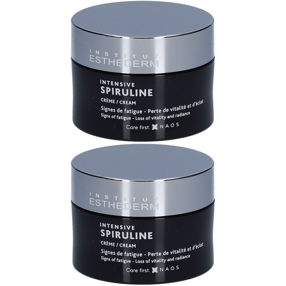 Deux pots noirs avec couvercles argentés. Inscription: INSTITUT ESTHEDERM, INTENSIVE SPIRULINE. Crème. Texte en français et en anglais.