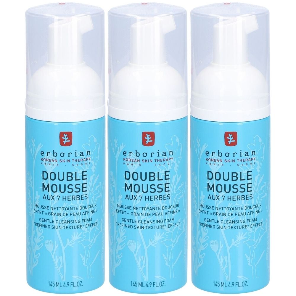 Trois flacons de mousse nettoyante pour le visage. Flacons cylindriques bleu clair avec bouchon blanc. Inscription : Double Mousse Aux 7 Herbes, 145 ml.