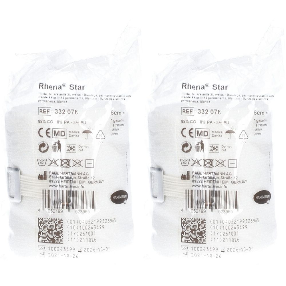 Deux emballages de bandages Rhena® Star. Bandes blanches et élastiques emballées dans du cellophane. Avec marquage CE et informations.