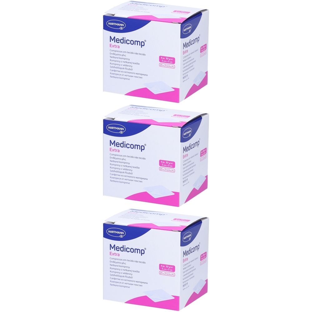 Drei Kartons Medicomp Extra. Aufdrucke: Medicomp Extra, 5x5 cm, S30. Verpackung mit weißen und pinken Elementen.